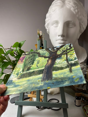 Angled view of Beneath the Old Tree showing the watercolour paper and painted surface.