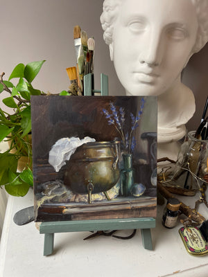 Brass and Lavender original oil painting on a studio easel, showing the complete unframed 20 × 20 cm Ampersand Claybord.